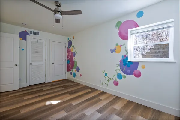 a room with toys and wooden floor