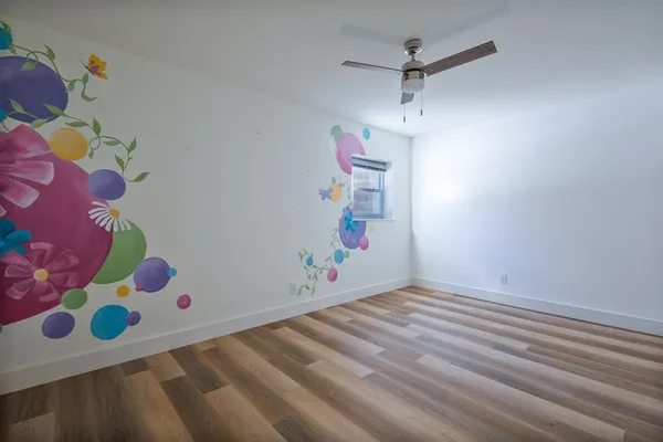 a room with toys and wooden floor
