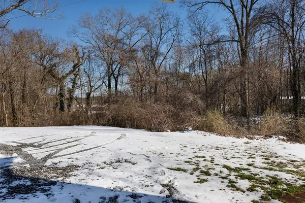 a view of side of snow with yard