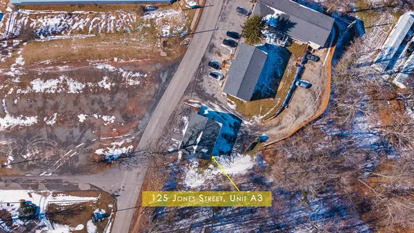 a view of swimming pool with sitting area
