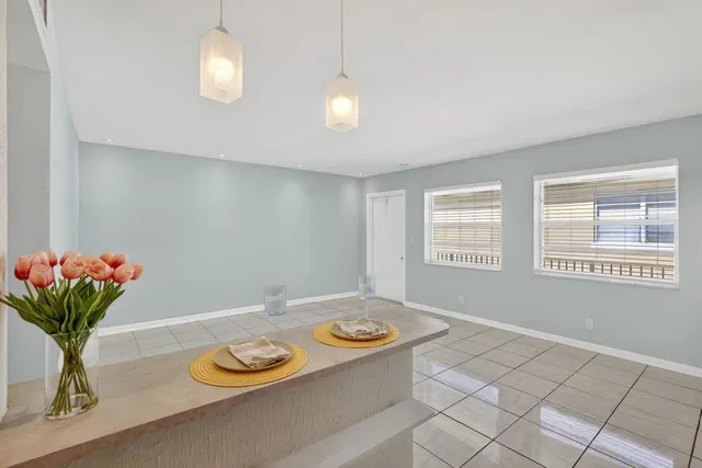 a kitchen with a refrigerator and a stove