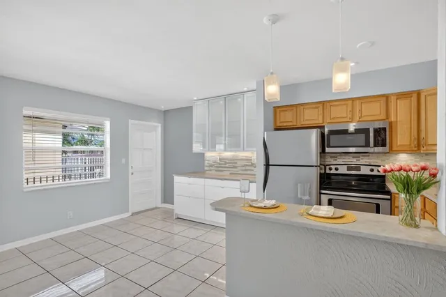 a white refrigerator freezer sitting in a kitchen