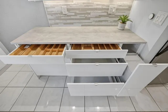 a view of living room with cabinets and microwave