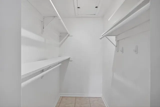 a bathroom with a sink toilet vanity and shower