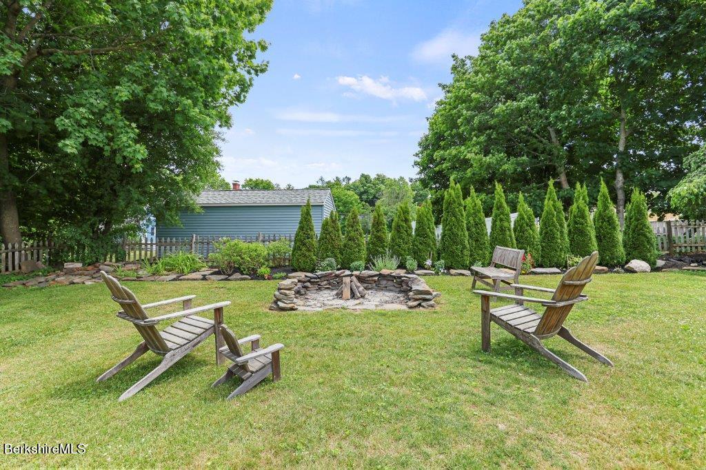 33 Eleanor Road Pittsfield, MA 01201 - Photo 45 of 45 a view of a backyard with chairs and garden