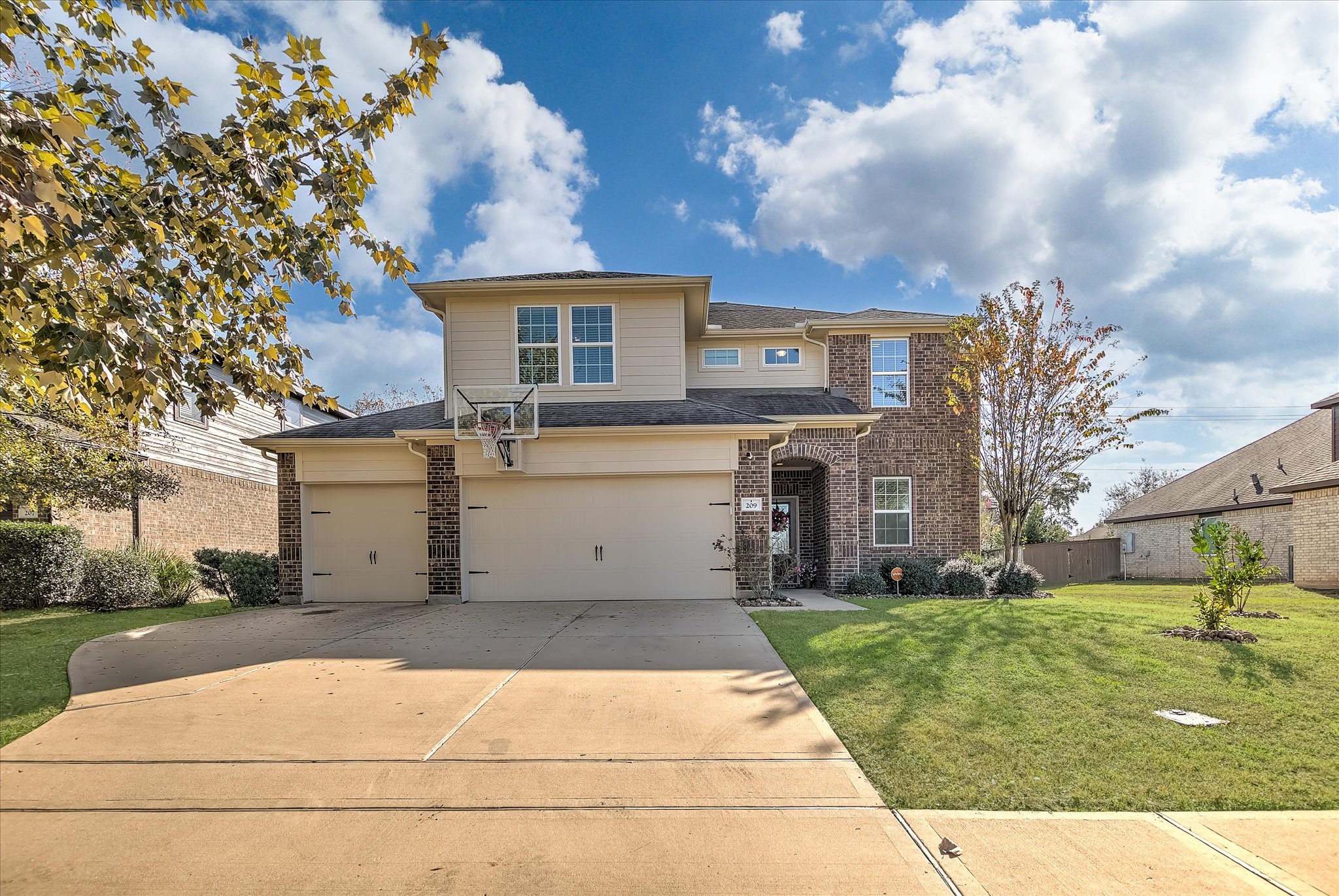 a view of a white house with a yard