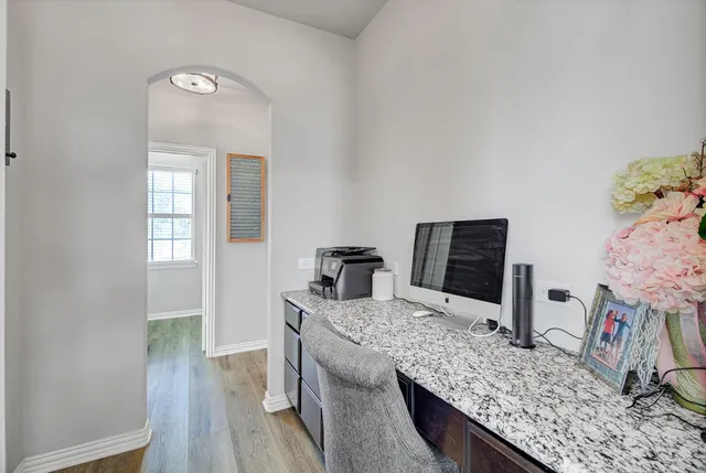 a kitchen with granite countertop a sink and stove