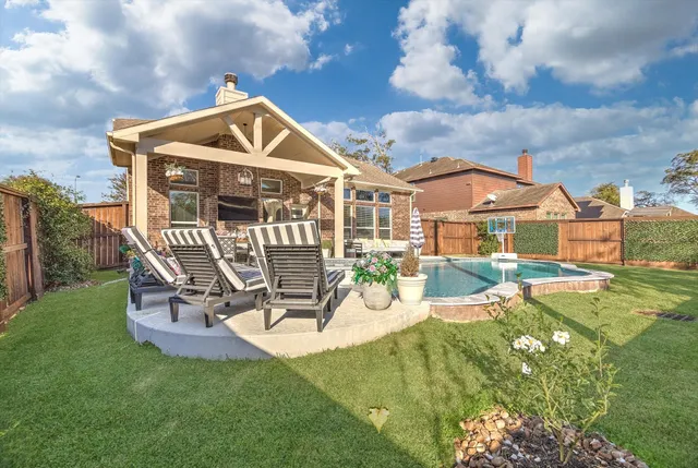 a view of a house with a yard porch and sitting area