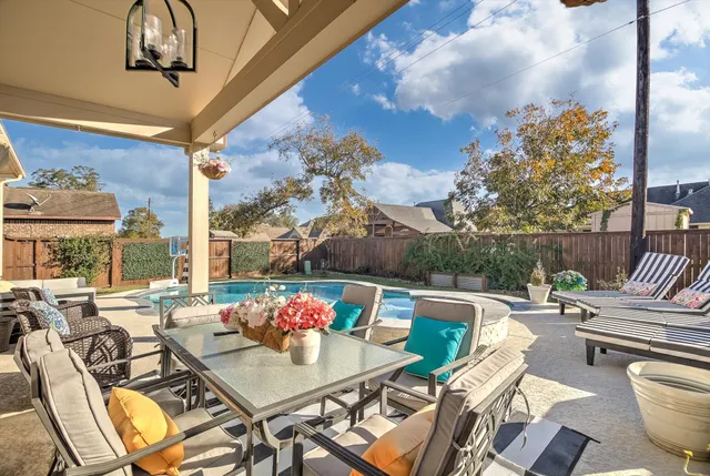 a outdoor dining space with furniture and outdoor view