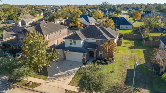 an aerial view of a house with a garden