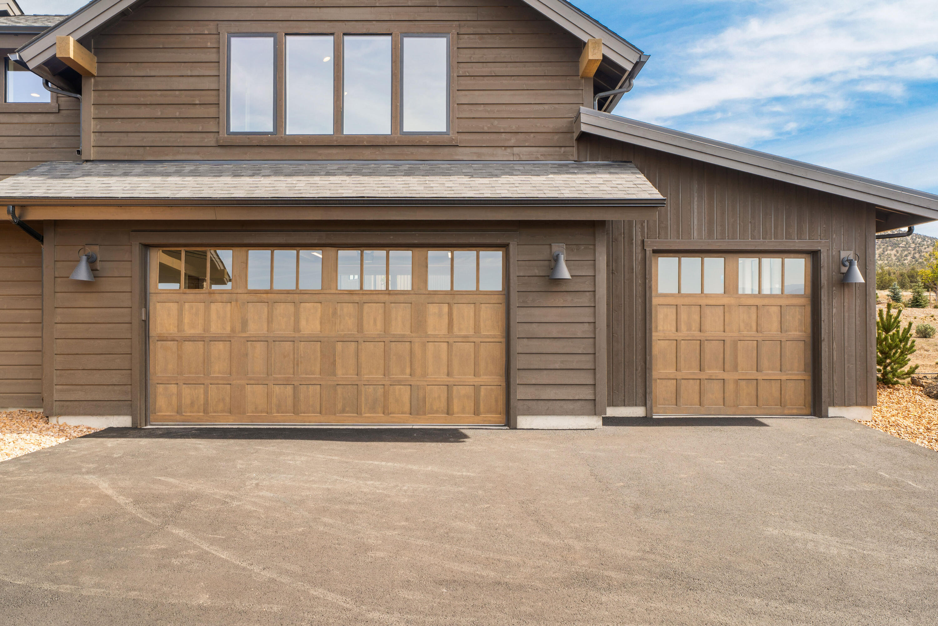 16883 Southwest Paragon Court Powell Butte, OR 97753 - Photo 32 of 42 Natural stain matches the home and features to the high desert around