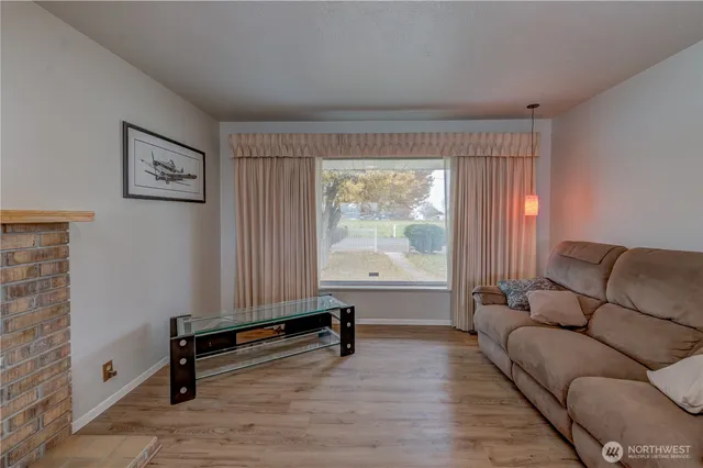 a living room with furniture and a window