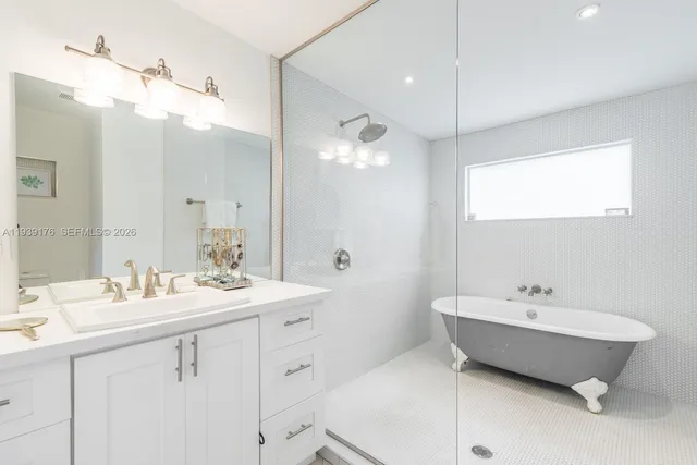 a spacious bathroom with a double vanity sink mirror and double