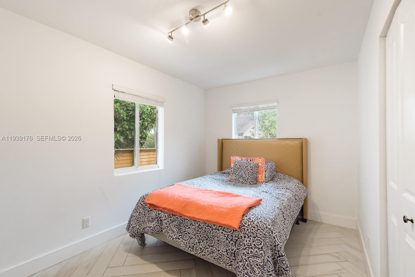 44 Northwest 40th Street Miami, FL 33127 - Photo 16 of 25 a bedroom with a bed and window