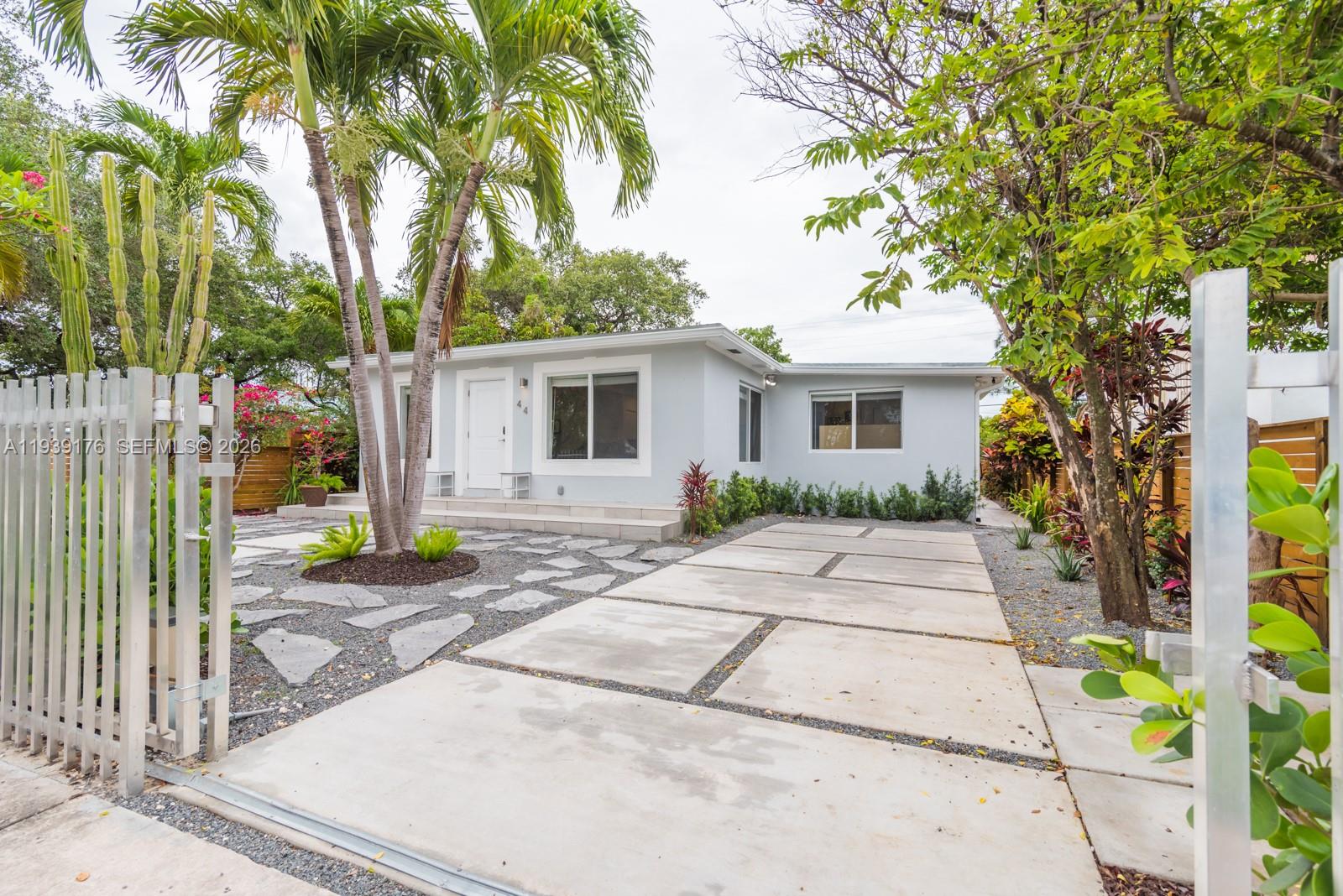 44 Northwest 40th Street Miami, FL 33127 - Photo 2 of 25 a view of a house with a patio
