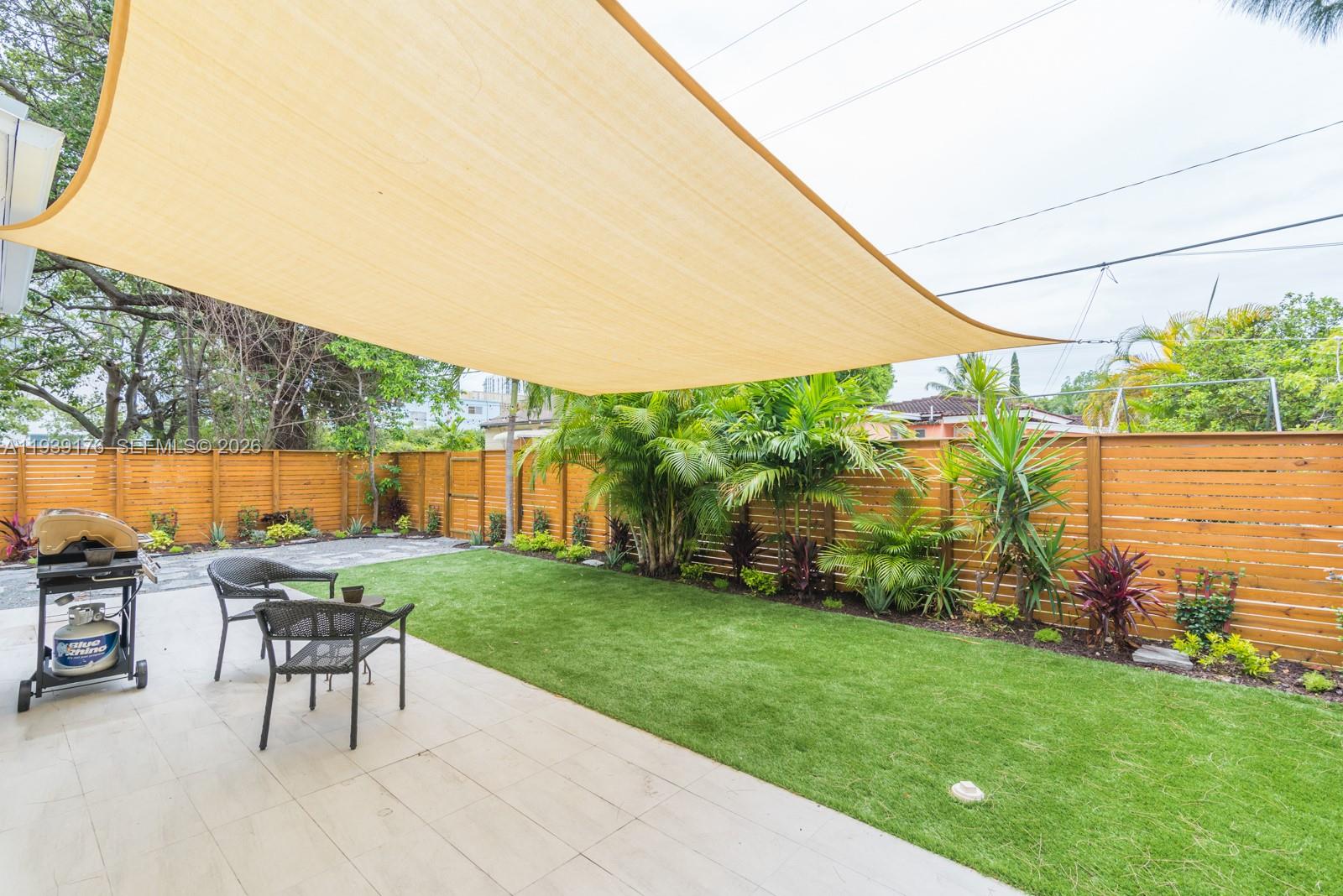 44 Northwest 40th Street Miami, FL 33127 - Photo 23 of 25 a view of a backyard with sitting area