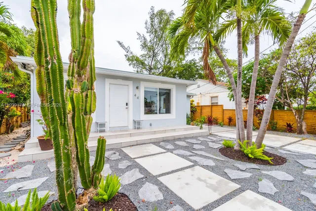 a view of a backyard with a garden