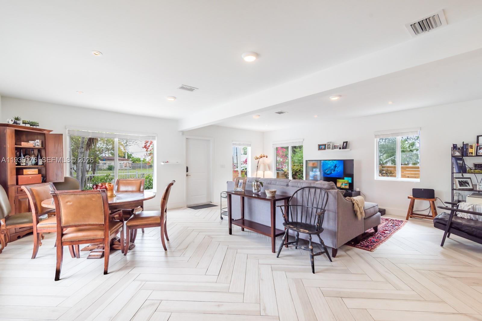 44 Northwest 40th Street Miami, FL 33127 - Photo 4 of 25 a view of a dining room with furniture window and outside view