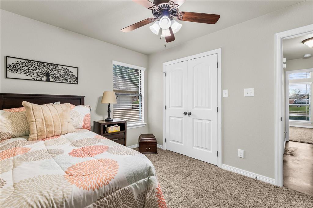 814 Springdale Circle Lorena, TX 76655 - Photo 23 of 37 Bedroom featuring neutral wall color, carpet flooring, a single window with blinds, and a ceiling fan
