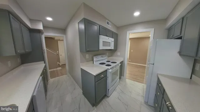 a utility room with a sink a washer and dryer