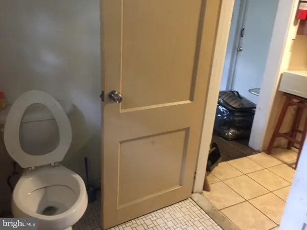 a bathroom with a toilet and a sink