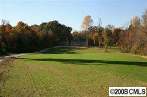 3432 Griffith Road Monroe, NC 28112 - Photo 2 of 4 a view of a golf course with a lake view