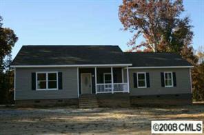 3432 Griffith Road Monroe, NC 28112 - Photo 3 of 4 a house that has a tree in front of it