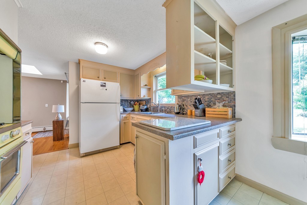 75 Palo Alto Road Springfield, MA 01128 - Photo 8 of 28 a kitchen with a sink stove and refrigerator