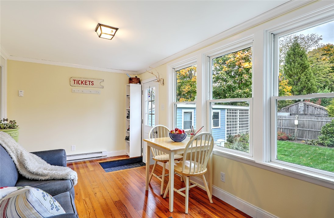 63 Maple Street Warren, RI 02885 - Photo 30 of 50 Heated Enclosed Porch overlooking side yard