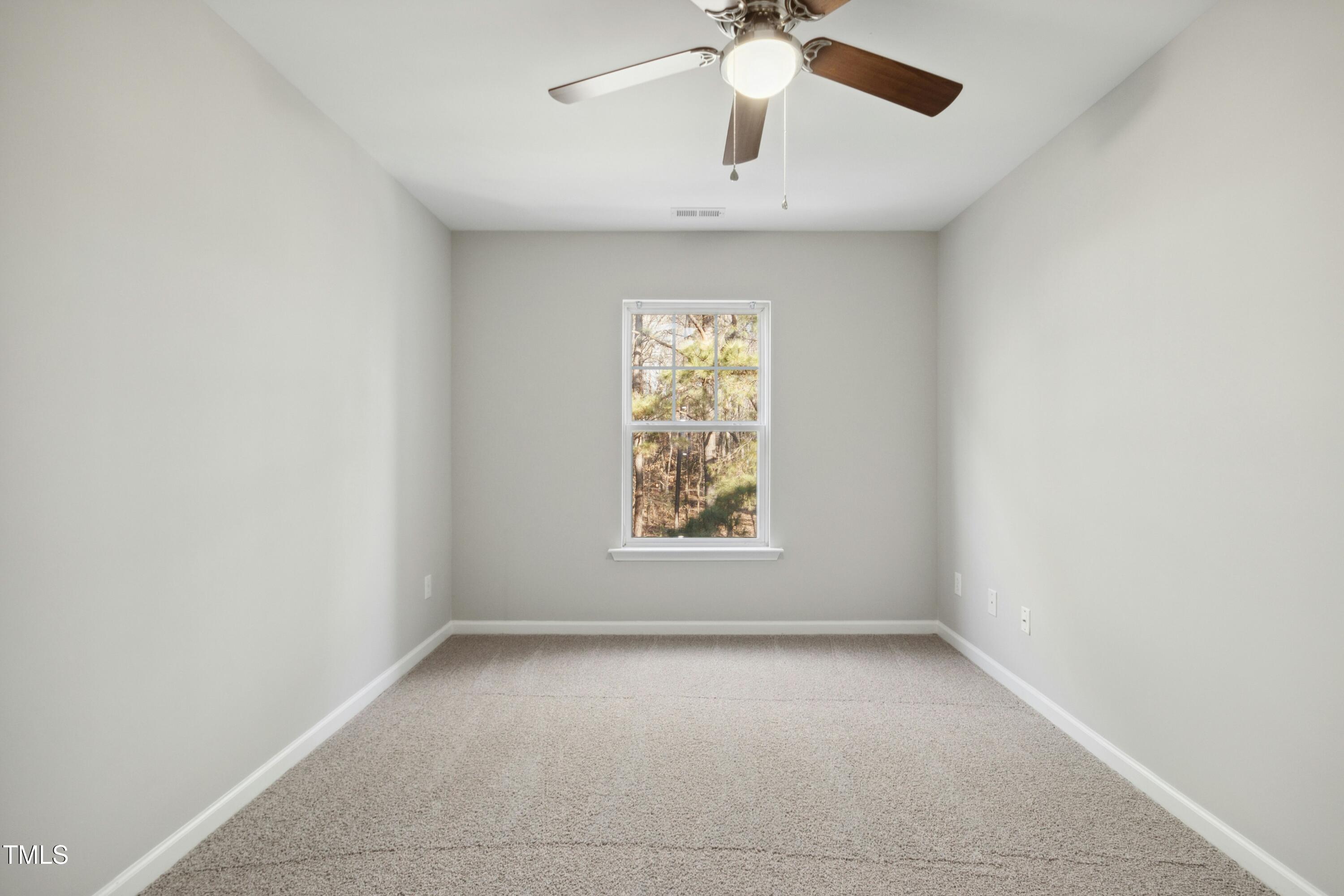 2225 Raven Road, Unit 107 Raleigh, NC 27614 - Photo 15 of 35 an empty room with a window and a fan
