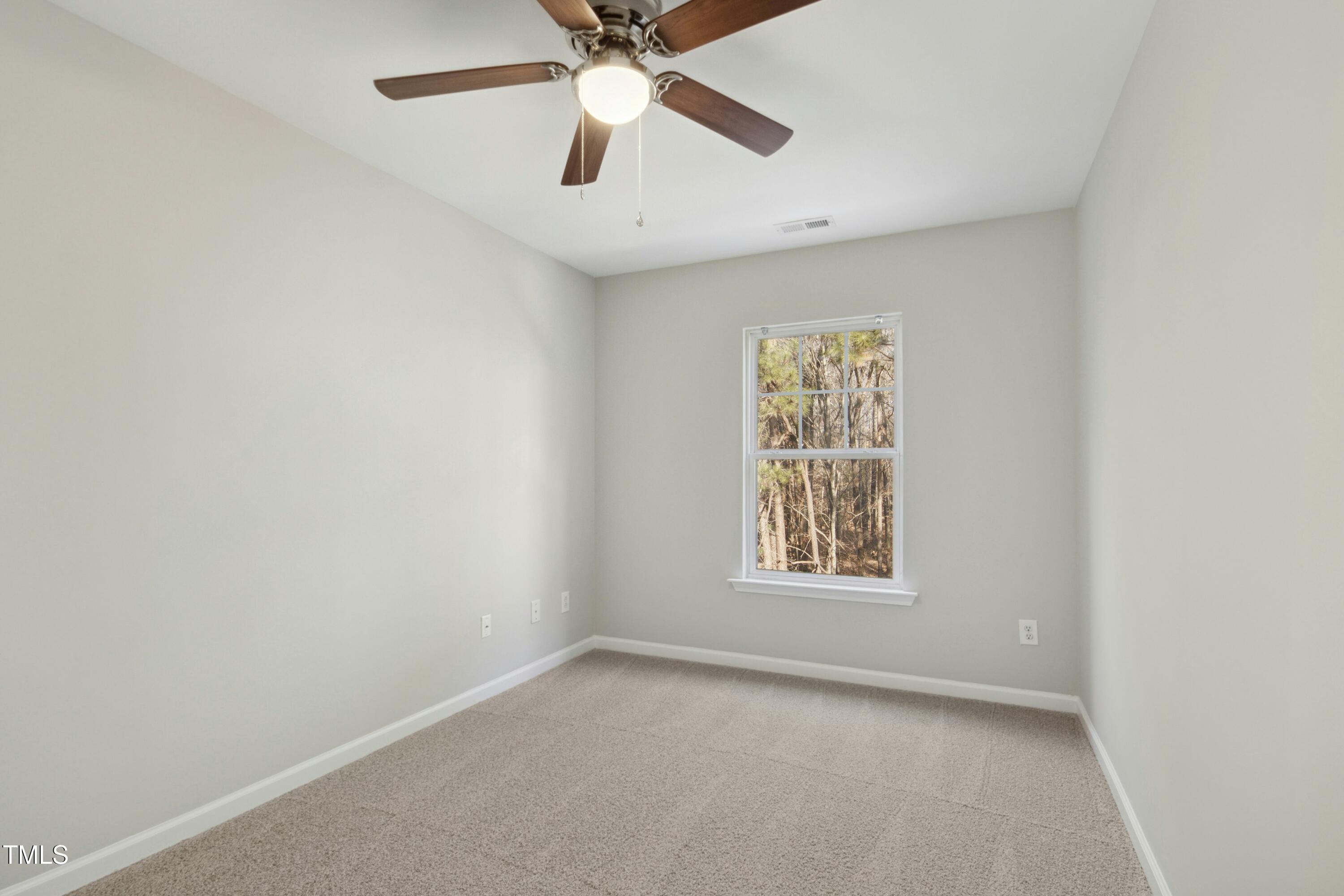 2225 Raven Road, Unit 107 Raleigh, NC 27614 - Photo 18 of 35 an empty room with a window and a fan