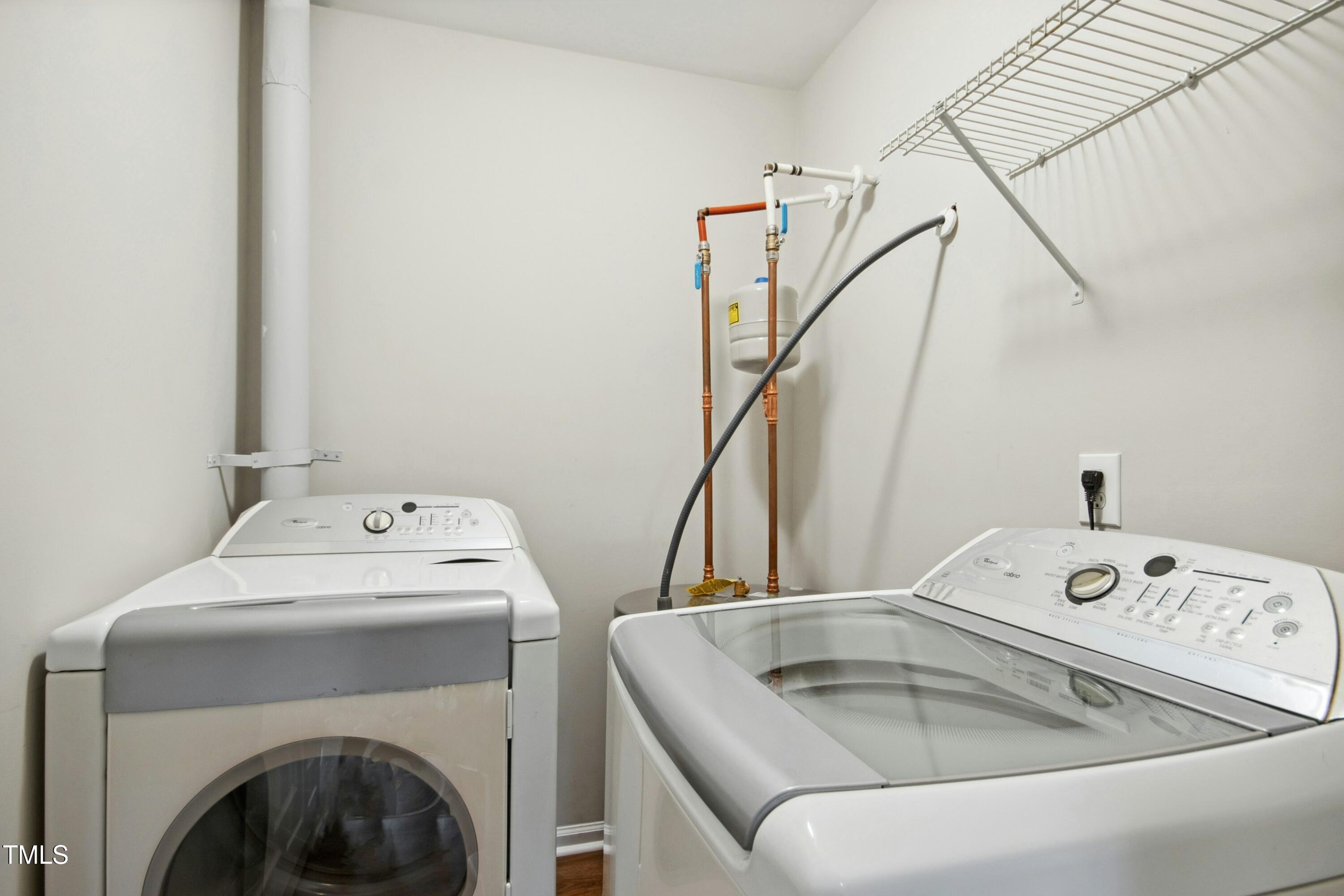 2225 Raven Road, Unit 107 Raleigh, NC 27614 - Photo 22 of 35 a utility room with dryer and washer