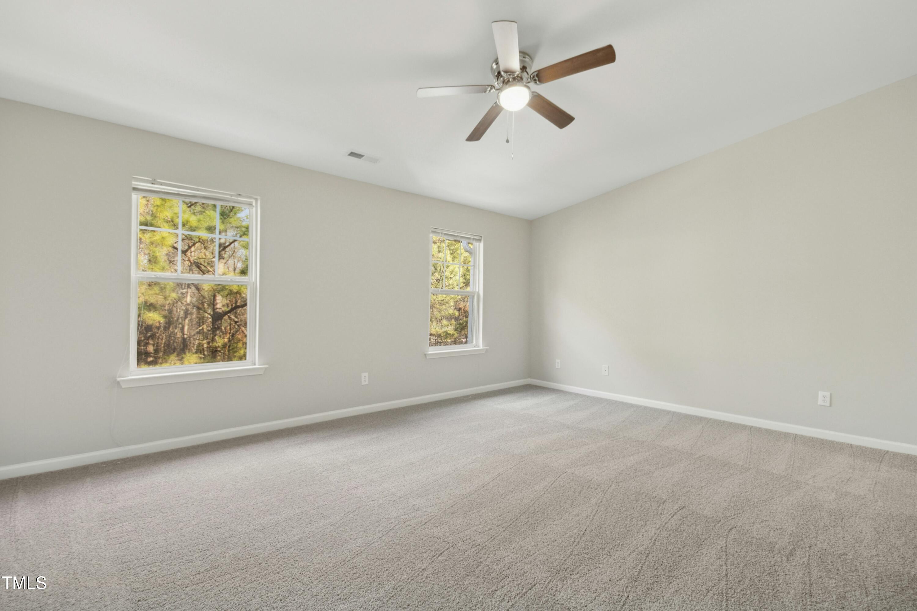 2225 Raven Road, Unit 107 Raleigh, NC 27614 - Photo 24 of 35 an empty room with windows and fan