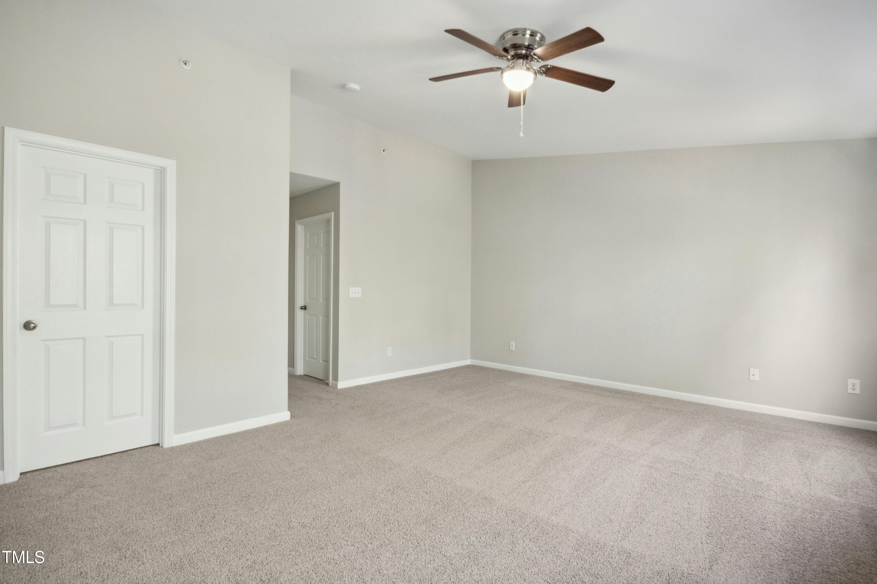 2225 Raven Road, Unit 107 Raleigh, NC 27614 - Photo 27 of 35 a view of a room with a ceiling fan and a window