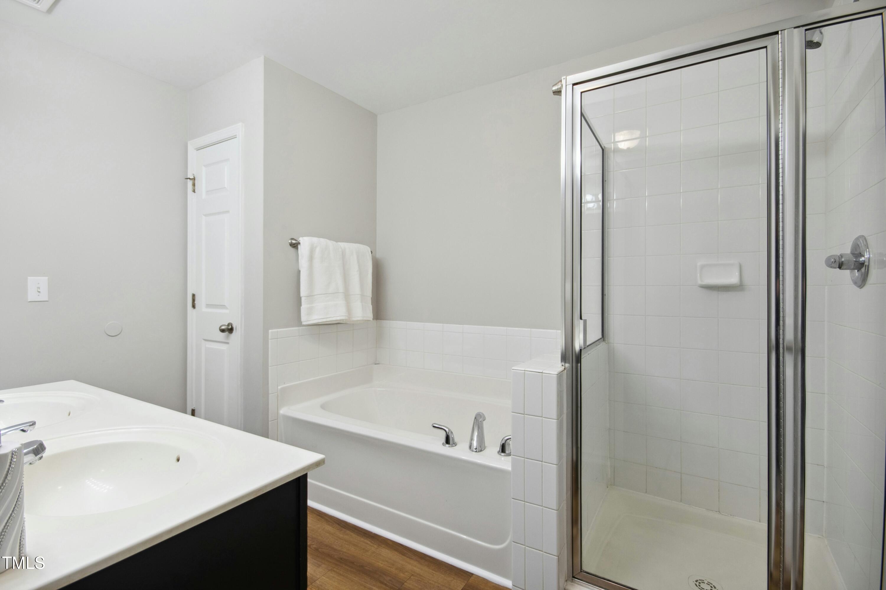 2225 Raven Road, Unit 107 Raleigh, NC 27614 - Photo 29 of 35 a bathroom with a tub and a sink