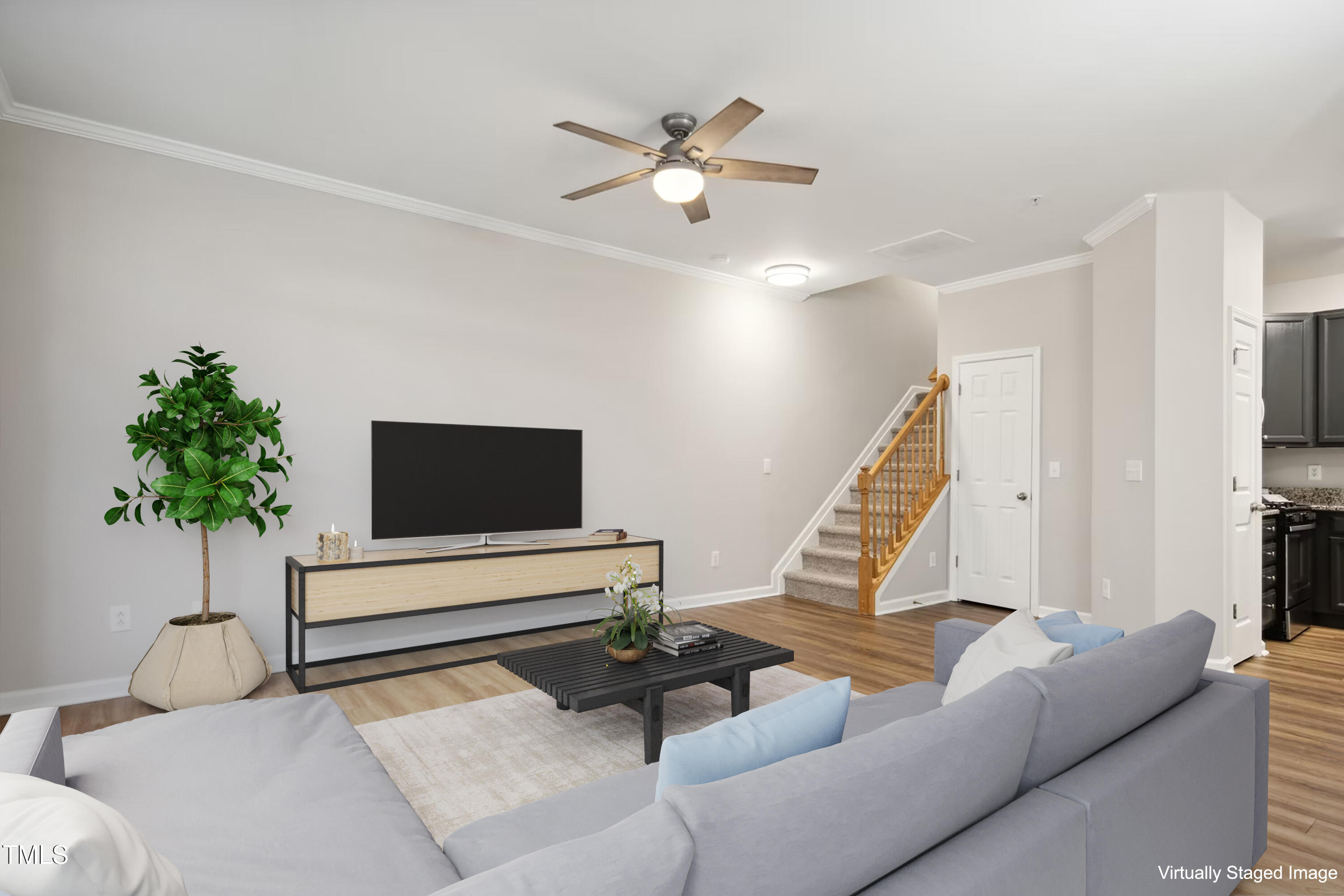 2225 Raven Road, Unit 107 Raleigh, NC 27614 - Photo 3 of 35 a living room with furniture and a potted plant
