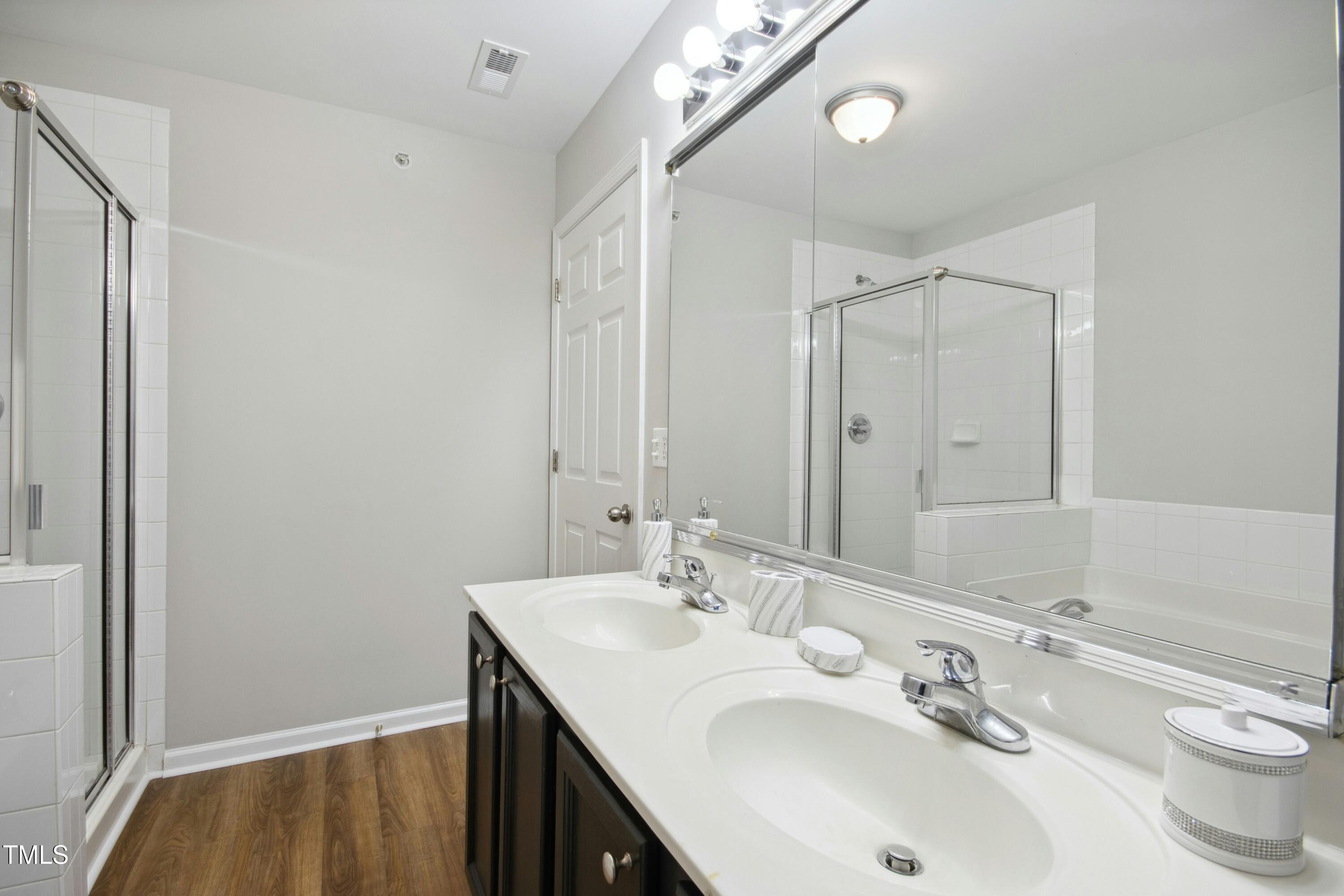 2225 Raven Road, Unit 107 Raleigh, NC 27614 - Photo 31 of 35 a bathroom with a sink and a mirror