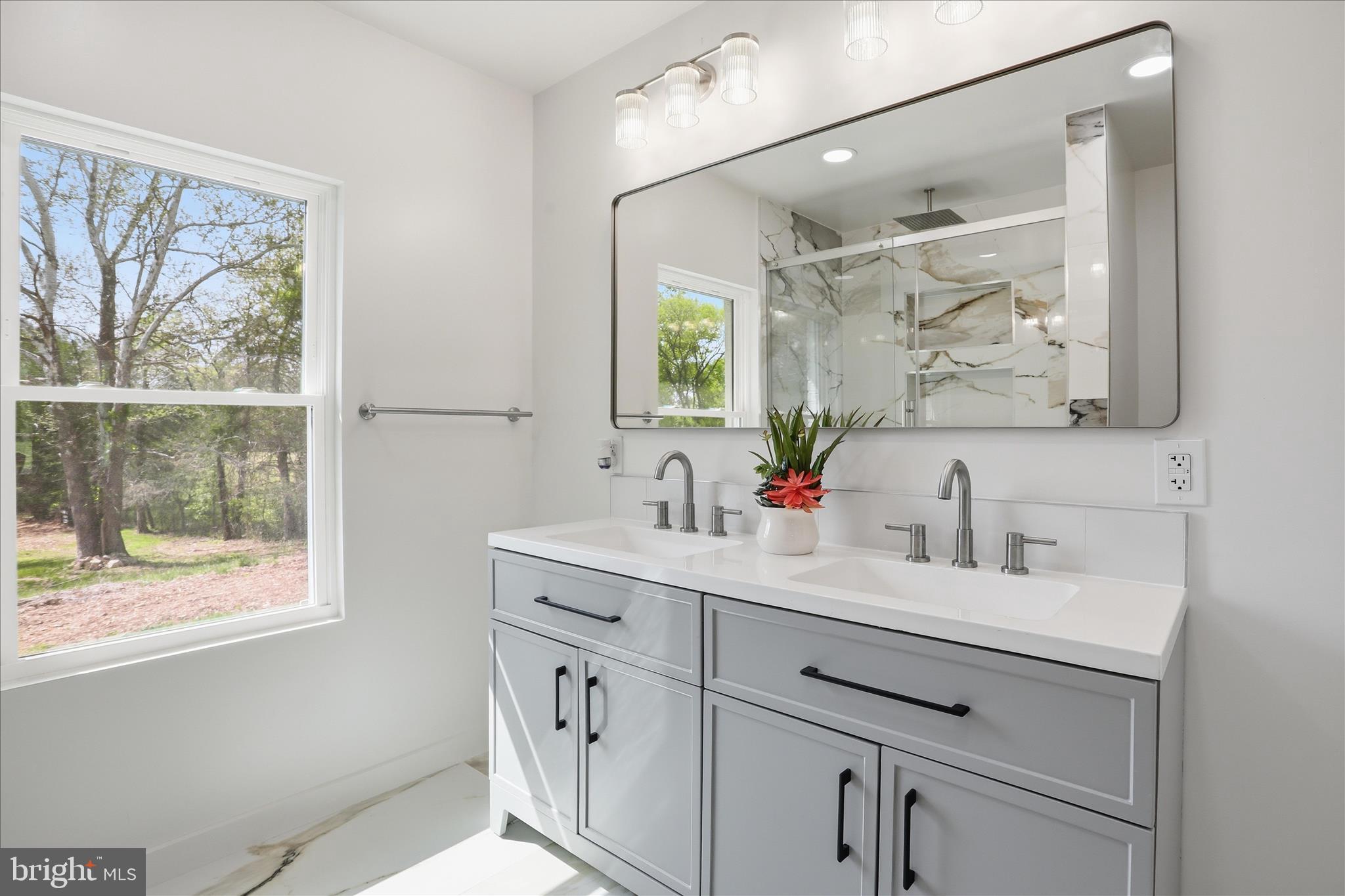 2502 Holly Springs Road Amissville, VA 20106 - Photo 28 of 52 a bathroom with a double vanity sink mirror and next to a window