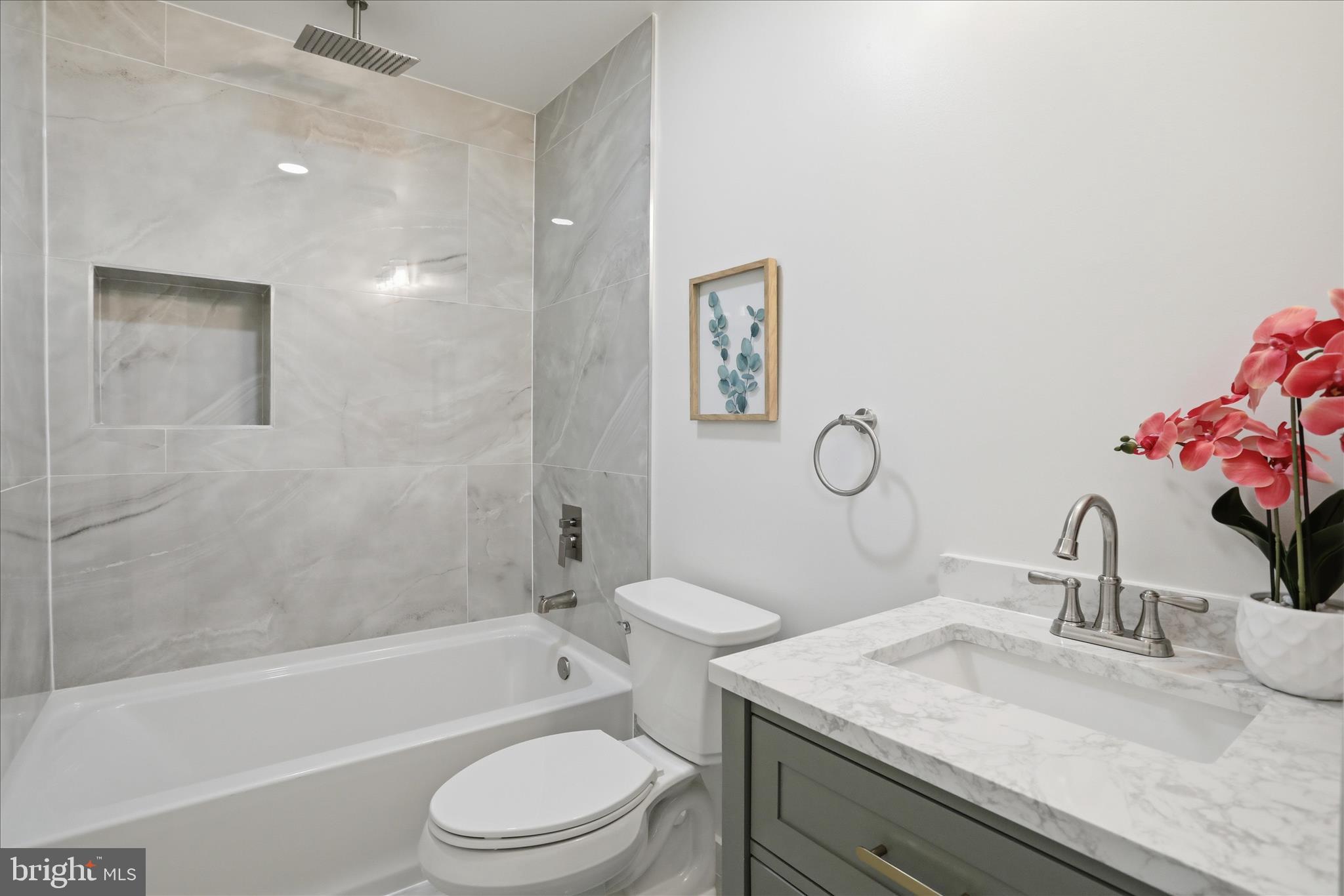 2502 Holly Springs Road Amissville, VA 20106 - Photo 35 of 52 a bathroom with a granite countertop toilet sink and mirror