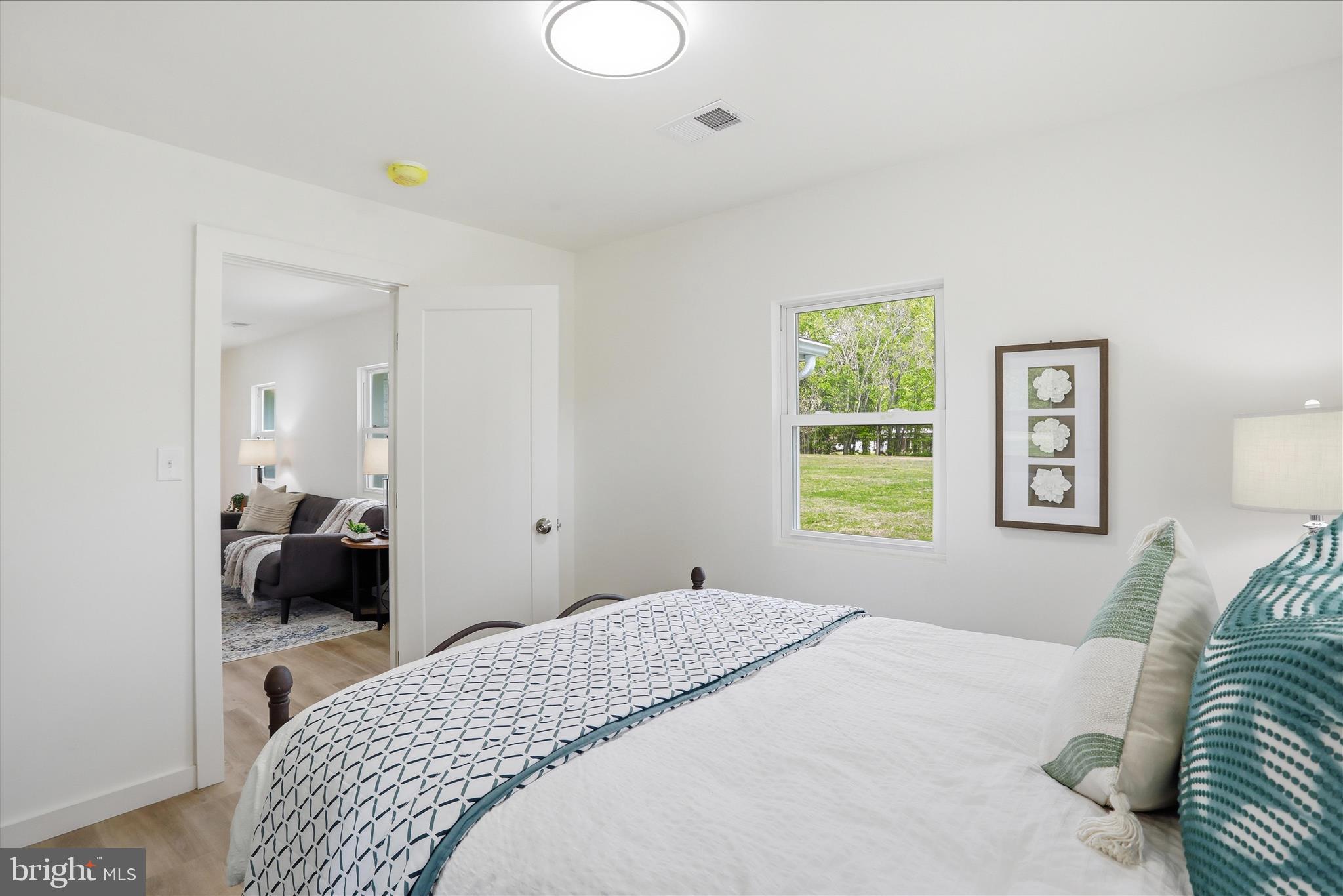 2502 Holly Springs Road Amissville, VA 20106 - Photo 37 of 52 a bedroom with a bed and a couch