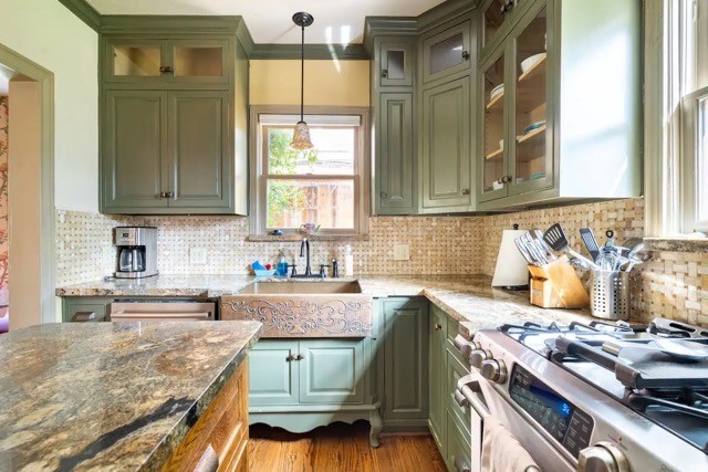 2505 Rosedale Street Houston, TX 77004 - Photo 16 of 39 a kitchen with a stove a sink and a cabinets