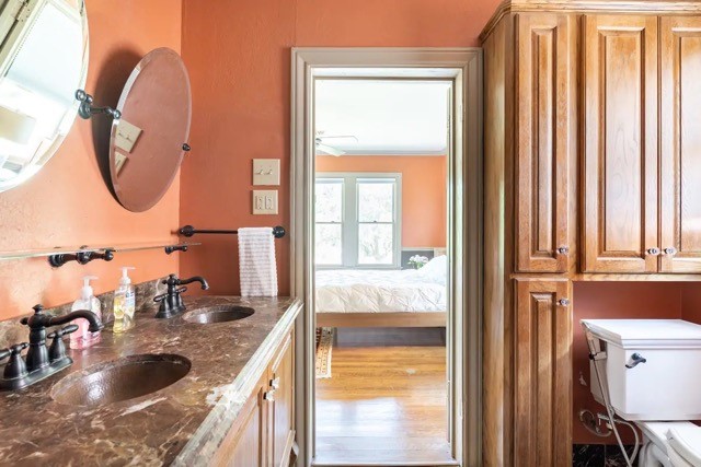 2505 Rosedale Street Houston, TX 77004 - Photo 29 of 39 a bathroom with a granite countertop sink and a mirror