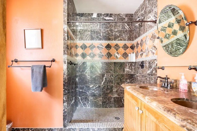 2505 Rosedale Street Houston, TX 77004 - Photo 30 of 39 a bathroom with a sink and a shower curtain