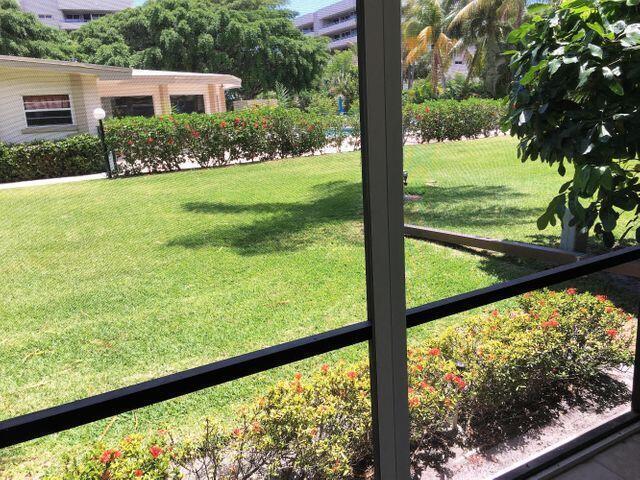 555 Banyan Tree Lane, Unit 109 Delray Beach, FL 33483 - Photo 12 of 17 a view of a garden from a window