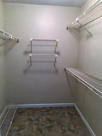 555 Banyan Tree Lane, Unit 109 Delray Beach, FL 33483 - Photo 14 of 17 a view of a room with racks on the wall