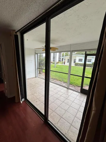 a view of a room with a large window