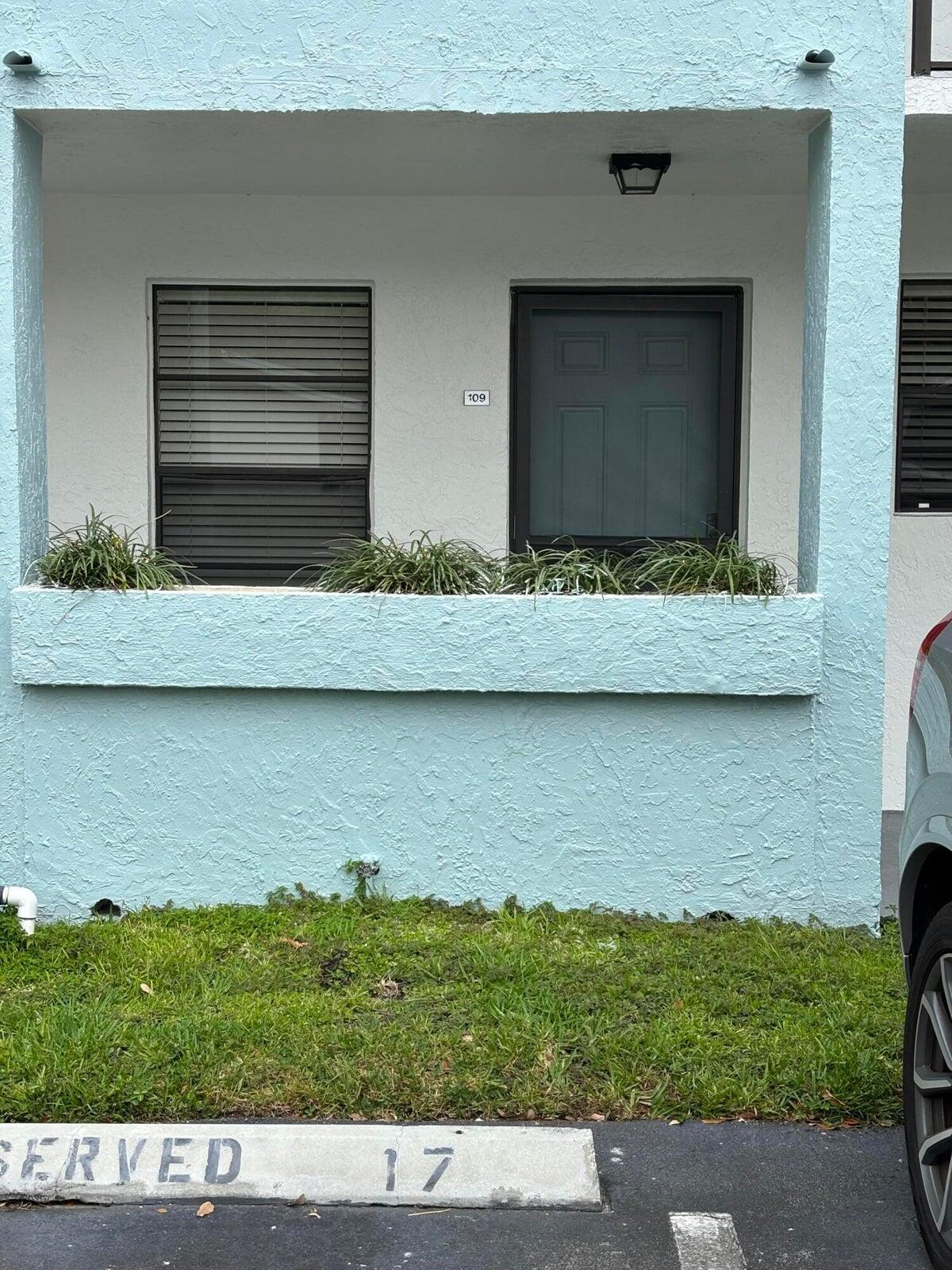 555 Banyan Tree Lane, Unit 109 Delray Beach, FL 33483 - Photo 10 of 17 a view of house with a yard