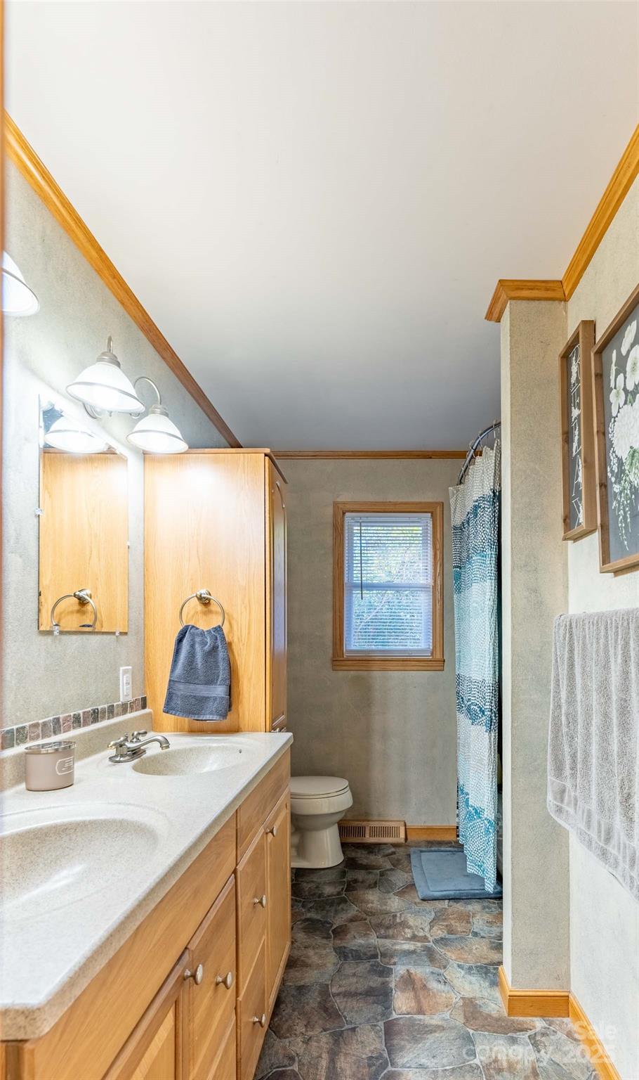 1000 Mountain View Church Road Zirconia, NC 28790 - Photo 12 of 22 a bathroom with a sink and a mirror