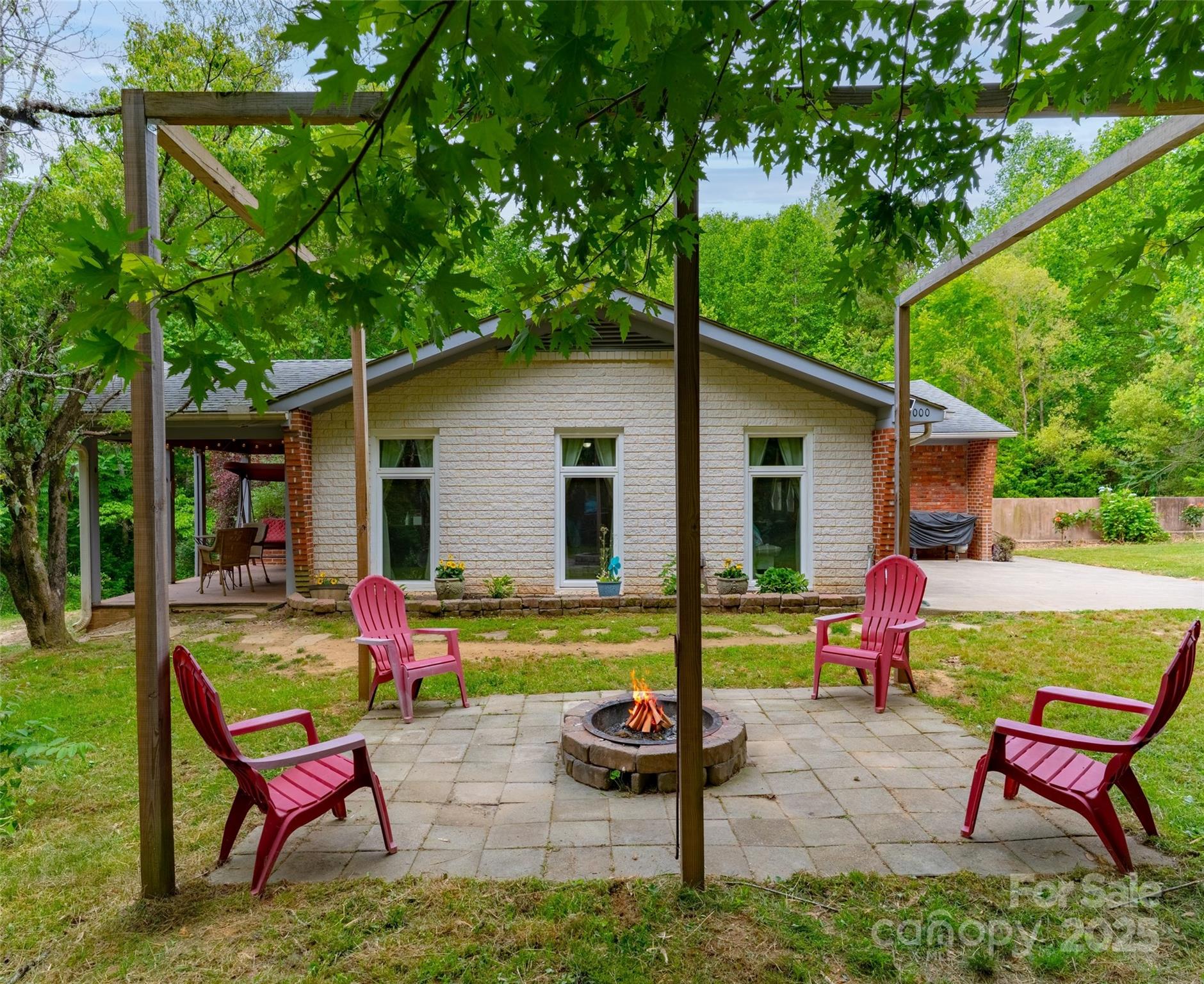 1000 Mountain View Church Road Zirconia, NC 28790 - Photo 4 of 22 a backyard of a house with seating space