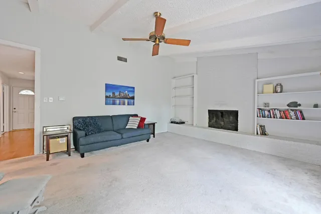 a kitchen with stainless steel appliances kitchen island wooden floors and white cabinets